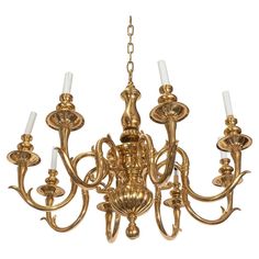 an antique brass chandelier with six lights