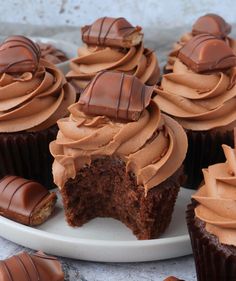 cupcakes with chocolate frosting on a plate