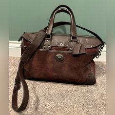 Beautiful Coach Suede Rhyder Bag! Gently Used And Ready For Lots Of More Wear! This Oxblood Color Is Stunning. See Pics The Bag Is In Fantastic Shape. 13” Length, 9”Height, 7.5” At The Base. This Has A Crossbody Strap Too Plus The Handles I Love That Combination. Offers Welcome And Check Out My Closet! If You Love Coach I Have A Ton In There. Designer Travel Bag For Everyday Use, Designer Burgundy Bag With Handles, Designer Burgundy Leather Bags, Coach Rectangular Satchel With Leather Handles, Coach Satchel With Leather Handles, Coach Briefcase For Everyday Use, Luxury Burgundy Coach Bag, Coach Burgundy Bag With Top Carry Handle, Coach Burgundy Shoulder Bag For Everyday Use