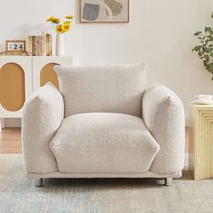 a living room with a white chair in it