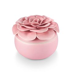 a pink box with a large flower on the top and bottom, sitting in front of a white background