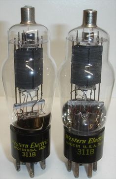 two vacuum tubes sitting next to each other