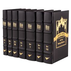 a set of black books with gold lettering