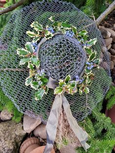 a mesh wreath is sitting on the ground