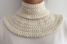 a woman wearing a white crocheted collar necklace