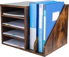 a wooden shelf with files and binders in it