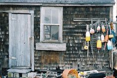 a shack with various items hanging from the roof