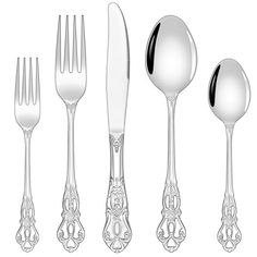 an assortment of silverware including spoons, forks and knives with ornate designs on them