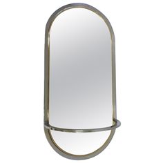 a mirror that is sitting on top of a table with a metal frame around it