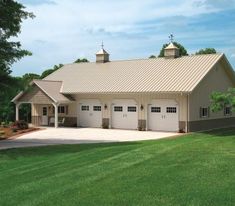 a two car garage sits in the middle of a grassy field