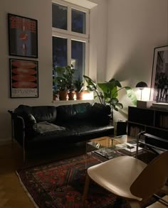 a living room filled with furniture and plants