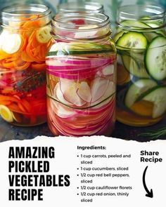 jars filled with pickled vegetables sitting on top of a table