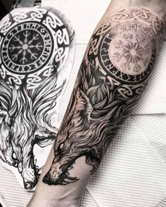 a man's arm with a clock and wolf tattoo on the left side of his arm