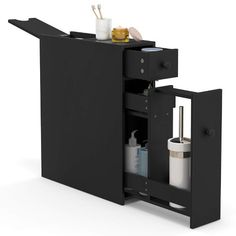 a black cabinet with two compartments and one door open to the other side that has items in it