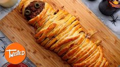 a wooden cutting board topped with a pastry