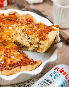 a close up of a pie on a plate with a slice taken out of it