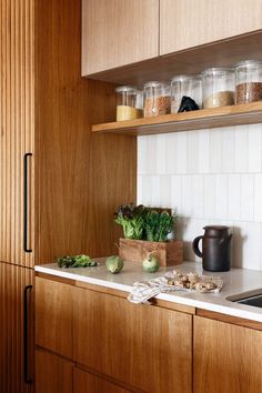 the kitchen counter is clean and ready to be used as a storage area for food