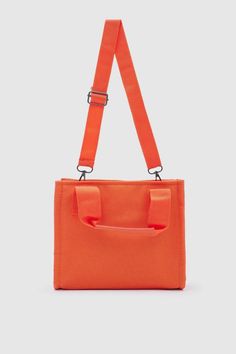 Introducing the "Canvas Fabric Orange Crossbody Bag" from Lunarity Garage – a vibrant and stylish accessory that combines the durability of canvas fabric with a pop of orange color. Crafted with meticulous attention to detail, this bag offers both fashion and functionality to suit your everyday needs. Make a bold statement with the Canvas Fabric Orange Crossbody Bag – a perfect blend of durability and trendiness. The vibrant orange color adds a touch of energy and excitement, making it a versati Orange Canvas Travel Bag, Large Capacity Orange Canvas Tote Bag, Large Capacity Orange Shoulder Canvas Bag, Orange Canvas Bag For Daily Use, Orange Canvas Bag With Large Capacity For Daily Use, Orange Large Capacity Canvas Bag For Daily Use, Orange Canvas Bag For Daily Summer Use, Orange Canvas Bag For Daily Use In Summer, Orange Canvas Shoulder Bag For Everyday Use