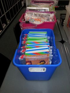 several plastic containers with toothbrushes in them