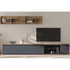 an entertainment center with two shelves and a flat screen tv mounted on it's wall