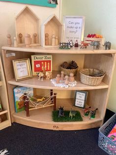 a book shelf filled with lots of books and toys