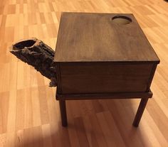 a piece of wood that has been placed on top of a table with a hole in it