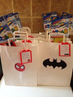 several bags with batman stickers on them