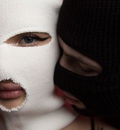 a woman wearing a white mask covering her face