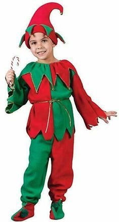 a young boy dressed in an elf costume