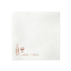 a white napkin with an orange wine bottle and glass on the front, in red ink