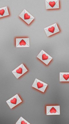 envelopes with hearts flying out of them on a gray background and red light coming from the envelope