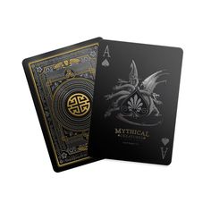 a black playing card with gold foil on the front and back cover, featuring an image of a dragon