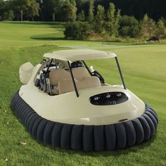 an inflatable golf cart on the grass