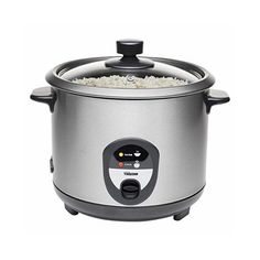 an electric rice cooker is shown with the lid open and rice in it's center