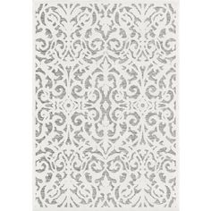 a white and gray rug with an intricate design