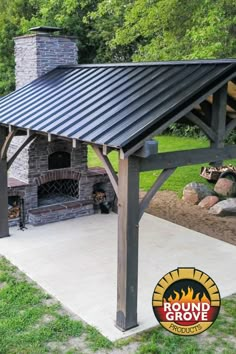 an outdoor fireplace and grill in the middle of a yard