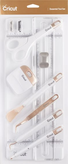 the cricut essential tool set includes all kinds of tools, including scissors and measuring tape