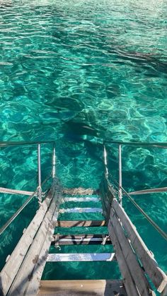 stairs lead down to the clear blue water