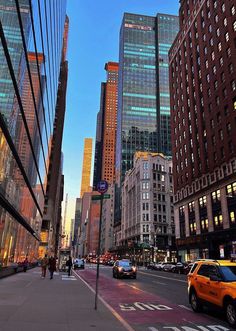 a city street filled with lots of tall buildings