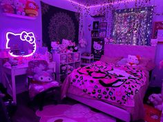 a bedroom decorated in pink and purple with hello kitty decorations