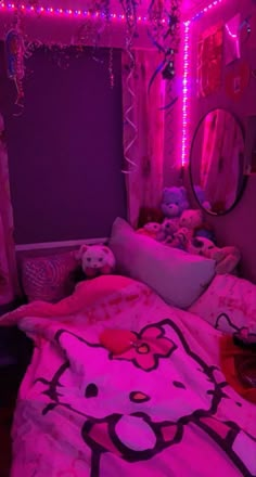 a bedroom decorated in pink and purple with hello kitty bedding