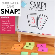 an image of a snap game on the floor with words and numbers in front of it