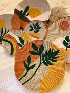 several woven baskets with different designs on them