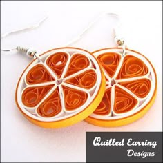 two orange slices shaped like circles with silver earwires on white background text reads quilted earrings designs