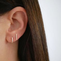 The Gold Mini Bar Stud Earring keeps every stack right in line. Featuring a solid 14k gold bar, this shiny stud can be angled left, right, up, down—and definitely around town. Earring Inspo, Huggie Earring, Love Sparkle, Bar Stud Earrings, Bar Studs, Diamond Glitter, Eternity Band Ring, Diamond Bar, Chain Extenders