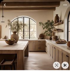 an image of a kitchen setting with vases on the counter