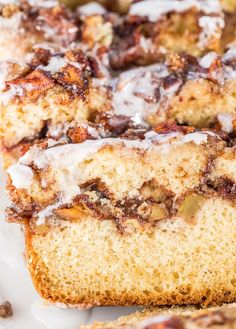 cinnamon roll bread with icing sitting on top of a white plate