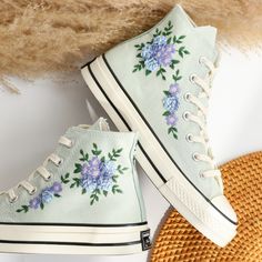 '' Custom Embroidered Converse High Tops, Blue Flower Embroidered Converse Shoes, Blue and Purple flowers Embroidered Sneakers Custom, Unique Gifts for Her '' 🍀 Price includes Converse Shoes and Floral Embroidery Designs as shown 🍀 🍀 Shoe Type: Converse 1970s 🍀 Shoe color:9. Summit Sage_1970s 1. DETAILS 🍀 You can send me your Converse, Vans, canvas shoes or I can buy them for you. Custom-ordered embroidered Vans and Converse shoes, please wait another 2-4 days. Each pair is hand embroidered to order, please make sure you put in the correct shoe size before you check out. The embroidery is meticulous and does not fade. 🍀 You will receive Vans and Converse shoes with floral embroidery designs as above. 2. PERSONAL EXPRESSION 🍀 Create your unique vibe by your own design of embroidery! Converse Shoes Blue, Embroidered Converse High Tops, Embroidered Vans, 1970s Shoes, Cute Converse Shoes, Embroidered Sneakers, Embroidered Converse, Cute Converse, Blue And Purple Flowers