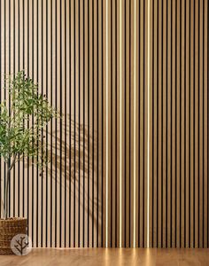 a potted plant sitting on top of a wooden table in front of a striped wall