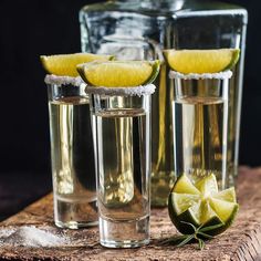 three glasses filled with water and lime slices